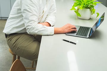 Man enjoying the benefits of office plant services.